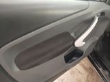 the door handle of a car is open and the door handle is empty