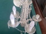 a table with a pool table and a chandelier on it