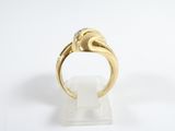 an image of a gold ring with a diamond on top of it