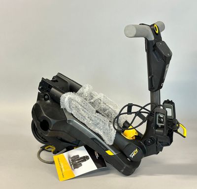 a close up of a scooter with a snowboard attached to it