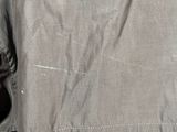 the back of a man ' s jacket with a zipper on it