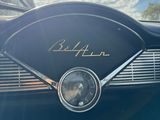 a close up of a car ' s dashboard with a clock on it