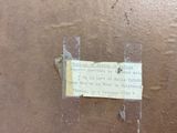 a piece of paper taped to the side of a box