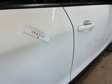 a sticker on the door of a white car