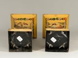 pair of black and yellow boxes with a picture of a man on a horse