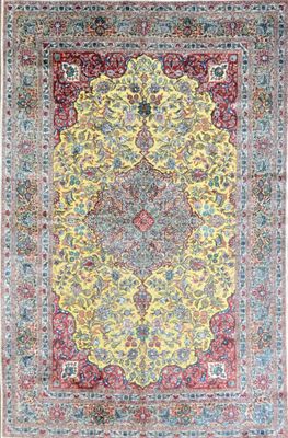 a yellow and blue rug with a medallion design on it