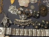 a lot of jewelry that is laying out on a table
