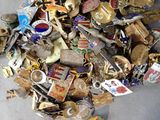 a pile of assorted metal items on a table