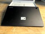 a laptop that is sitting on a wooden table