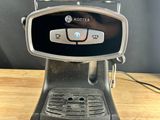 the coffee machine is sitting on the table ready to be used
