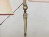 two lamps that are on a table with a mirror in the background