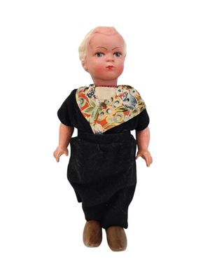 an image of a doll with a bandanna around it ' s neck