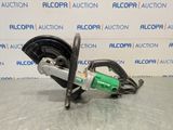 a close up of a machine on a table in front of a wall