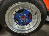 a close up of a tire with a blue wheel on it