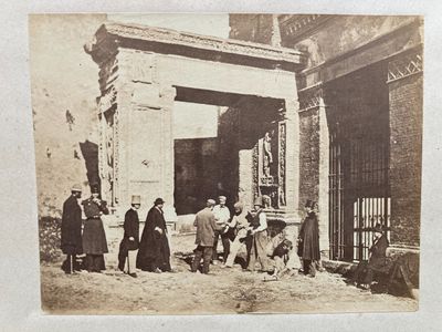 a group of people standing outside of a building