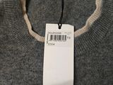 a tag on a sweater that says fedda