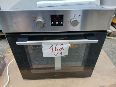 a silver oven with a price tag on the front of it
