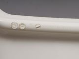 a close up of a toothbrush on a white surface