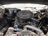 a picture of a car engine with its hood open