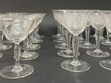 a lot of wine glasses sitting on a table