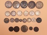 an image of a collection of different coins on a table