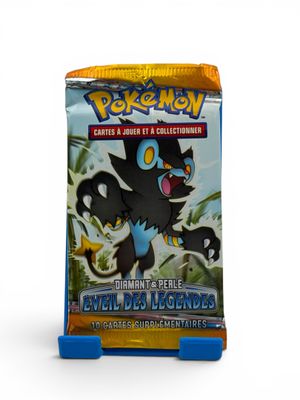 a close up of a box of pokemon trading cards on a white surface