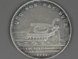 an image of a coin with a picture of a boat on it