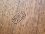 a close up of a wooden table with a stamp on it