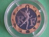 a coin with a picture of a winged angel on it