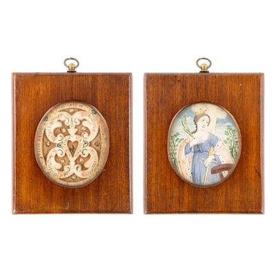 pair of framed miniature paintings of a woman and a man