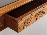 someone is taking a picture of a wooden desk with a glass top