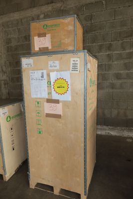 several cardboard boxes are stacked on top of each other in a warehouse