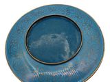 a blue plate with a picture of a cat on it