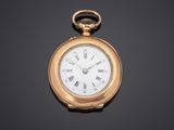 a gold pocket watch with roman numerals and roman numerals