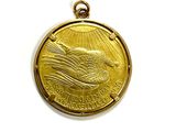 an image of a gold medal with a bird on it