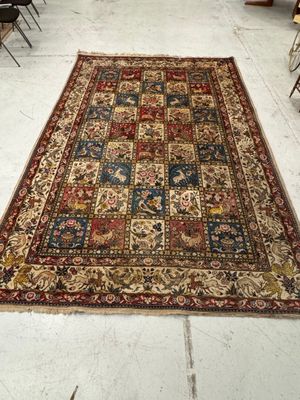 rug on the floor in a room with chairs and tables