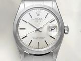 une photo d'une montre Rolex en acier inoxydable avec un cadran blanc
