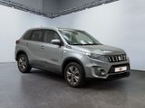 the silver suv is parked in the garage of a building