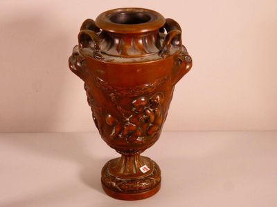 a brown vase that is sitting on a table