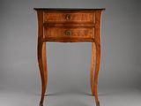 an old wooden table with a drawer on top of it