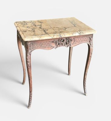 an old table with a marble top on a white background