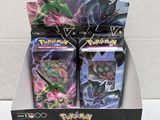 display of pokemon trading cards in a box on a table