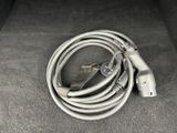 a cord that is connected to a power cord on the floor