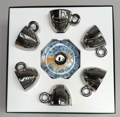 a picture of a set of tea cups and a clock