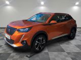 the orange suv is parked on a checkered tile floor