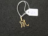 a tag that has a small gold elephant on it