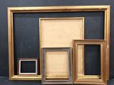 three frames with a picture and a picture in them on a table