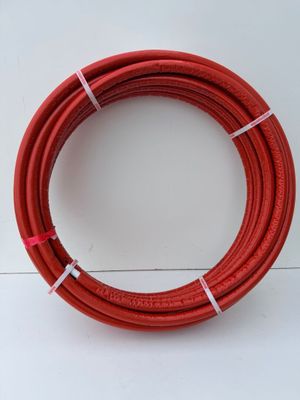 a red hose on a white surface