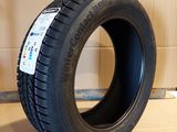 tire on the floor in a room with a cardboard wall