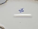 a close up of a plate with a blue and white design on it